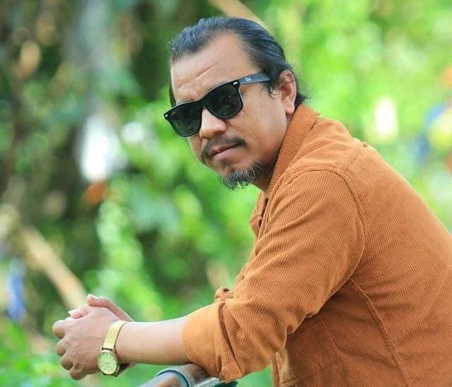 Arjun Gurung background portrait