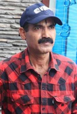 Badri Adhikari background portrait