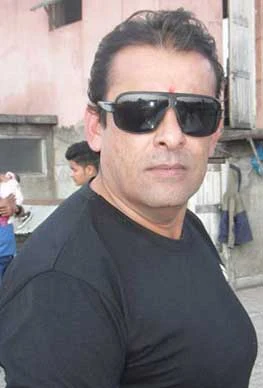 Dinesh Sharma background portrait