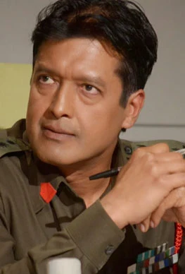 Rajesh Hamal background portrait